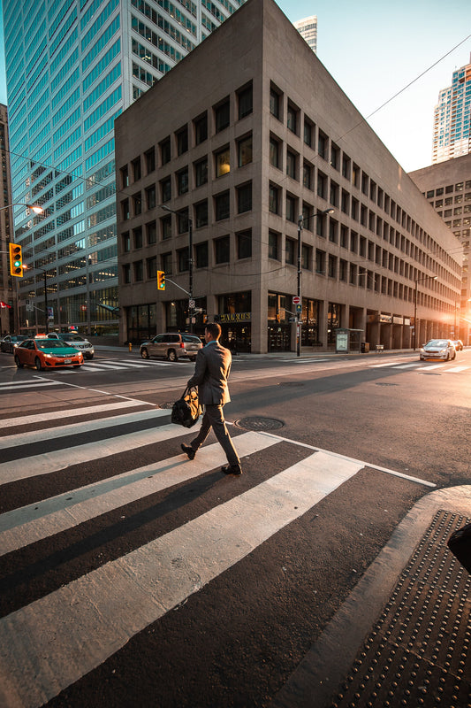 a man walking to work in the city