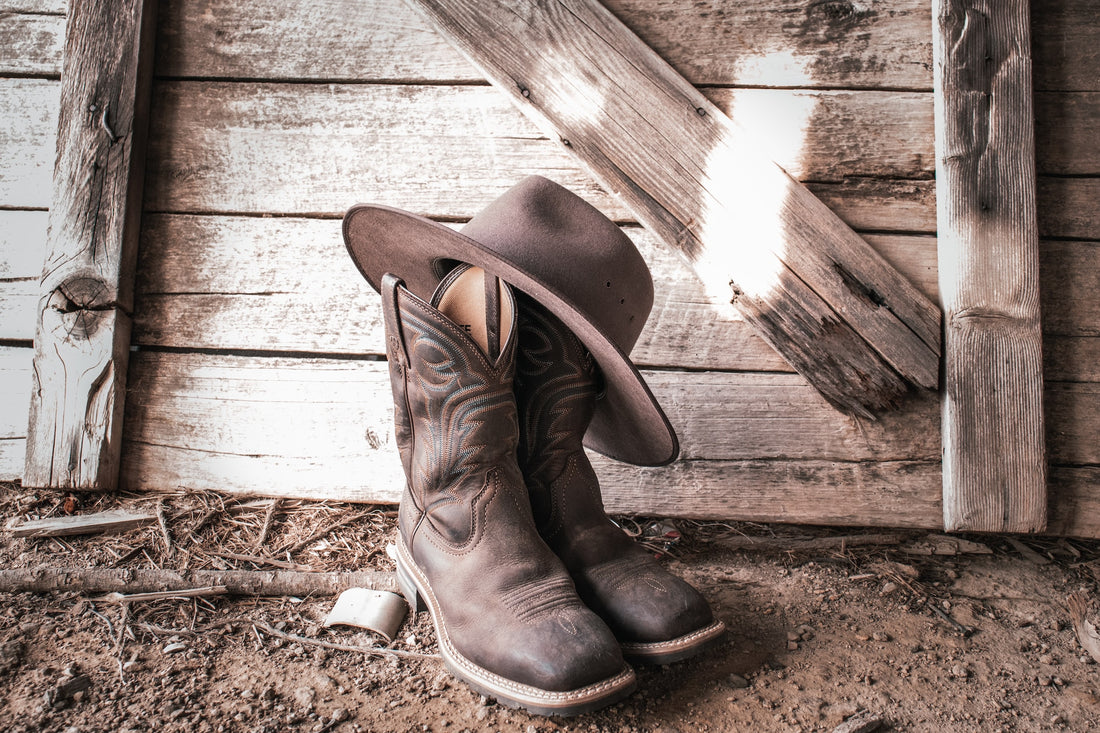 A pair of cowboy boots and a cowboy hat