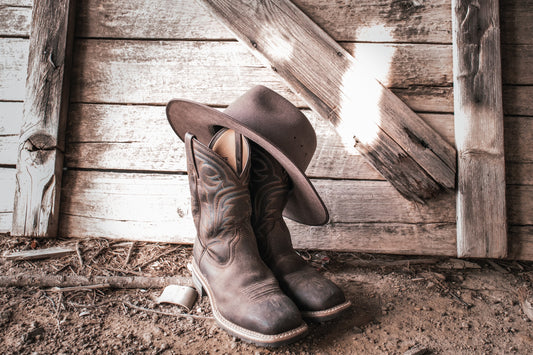 A pair of cowboy boots and a cowboy hat