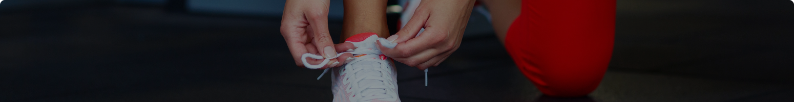 woman tying shoelace